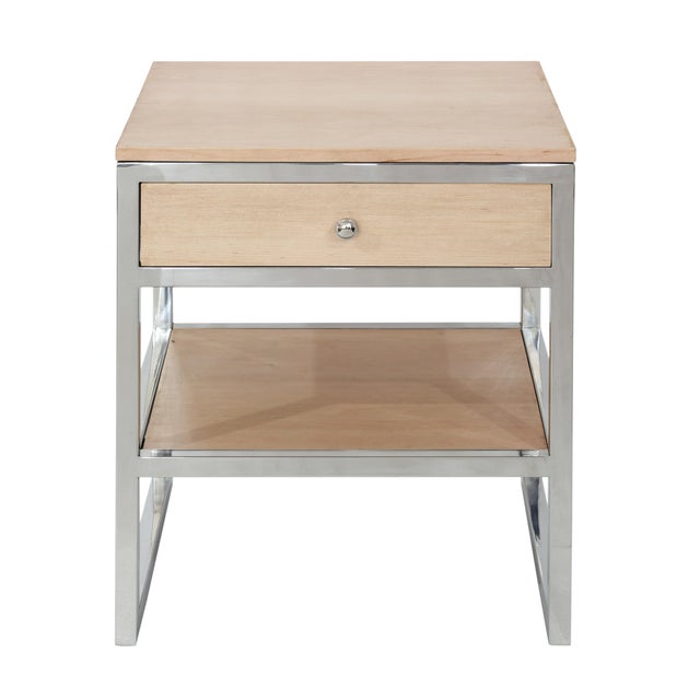 The Haven Side Table blends light wood and stainless steel for a sharp mid century modern look. Its angular frame balances...