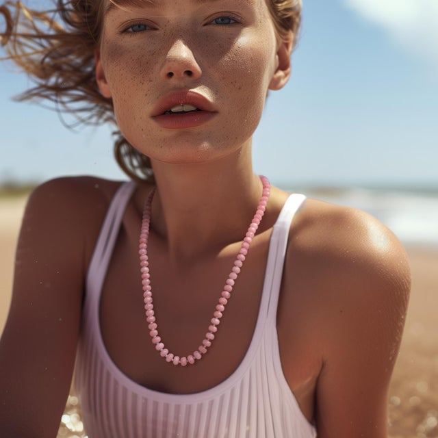 Embrace the gentle power of femininity with this pink Malaysian jade necklace. Its soft hue will envelop you in a sense of...