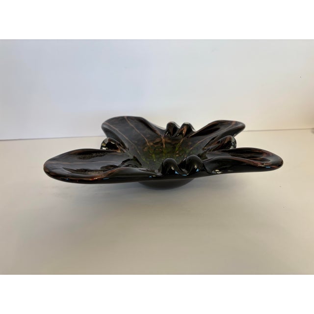 This mid-century modern butterfly ashtray or catchall with scalloped rims is a variegated brown and green with gold...
