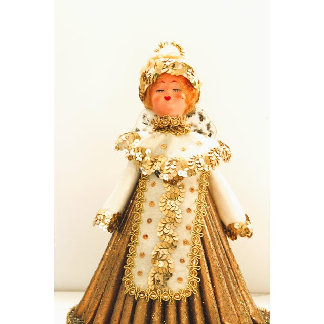 One-of-a-kind Christmas golden glitter cone angel. She has a soft angel face and head made of rubber. She wears a pretty...