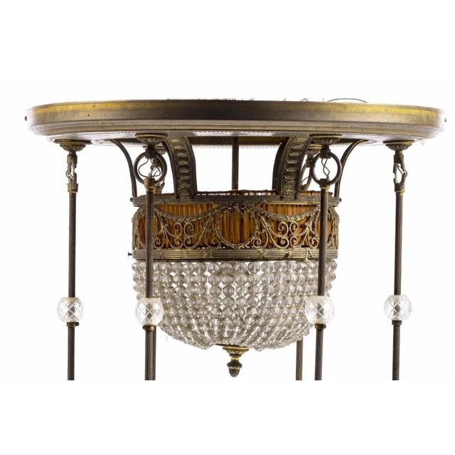 Seven light ceiling lamp 19th Century French, in golden metal with pendants. Height: 70 cm Good conditions. This piece is...