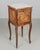 A French Loius XV style marble top nightstand or bedside cabinet. Crafted from solid walnut with hand-carved floral corner...