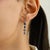 These elegant drop earrings features 8 oval cut natural blue sapphires totaling 2.2 carats, set in 14k white gold. Each...