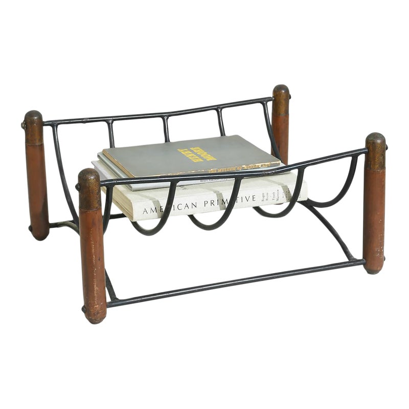 Metal and wood magazine rack with books
