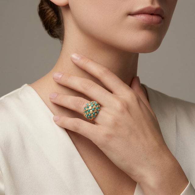 Discover the timeless elegance of our Vintage Bombe Ring, expertly crafted from 18k yellow gold and weighing 5.21g. This...