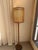 Elegant vintage Mid-Century Modern floor lamp 60” tall featuring a slender warm wood-tone column, circular weighted base...