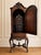 A highly decorative early 20th century Continental cabinet on stand, richly detailed with an arched paneled door, carved...