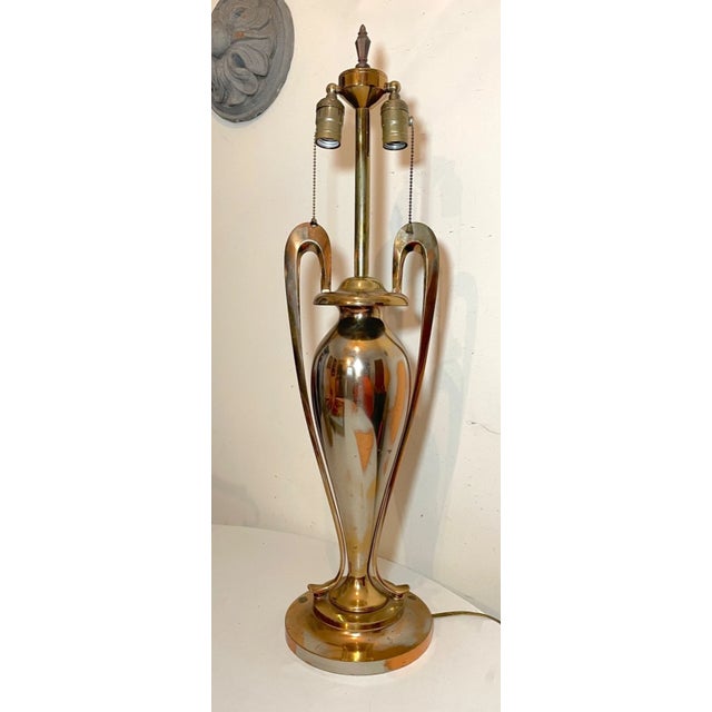 Up for sale is a very high quality antique solid bronze urn style modernist table lamp. This lovely lamp is made of...