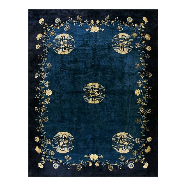 Refined Floral Border on Navy Background and Black Border Antique Chinese Peking Rug For Sale