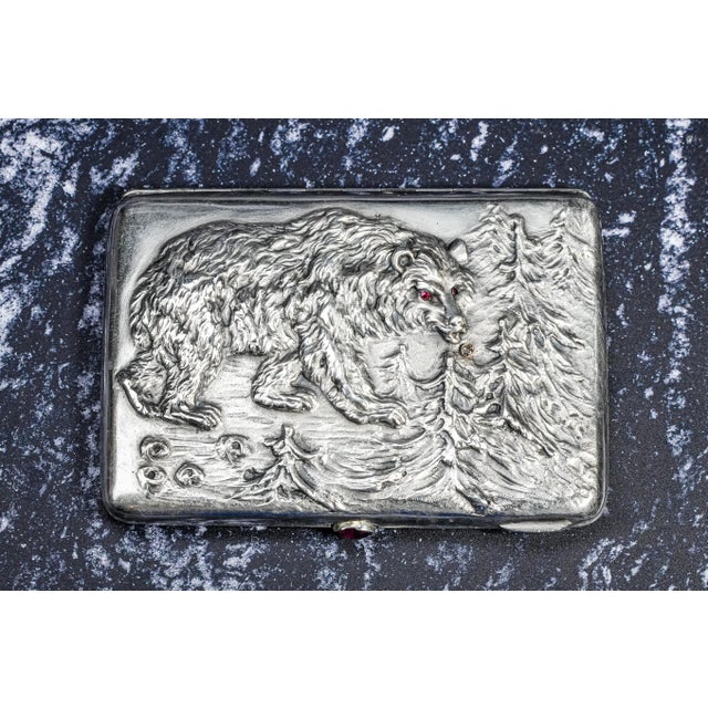 A rare and magnificent piece of craftsmanship, this circa 1900 silver cigarette case is hallmarked for 875 silver and...