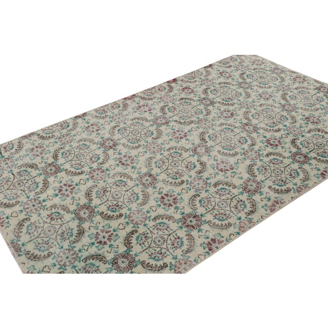 Handknotted in wool, this 5x8 vintage rug originates from Turkey, circa 1960-1970 and is believed to hail from the Turkish...