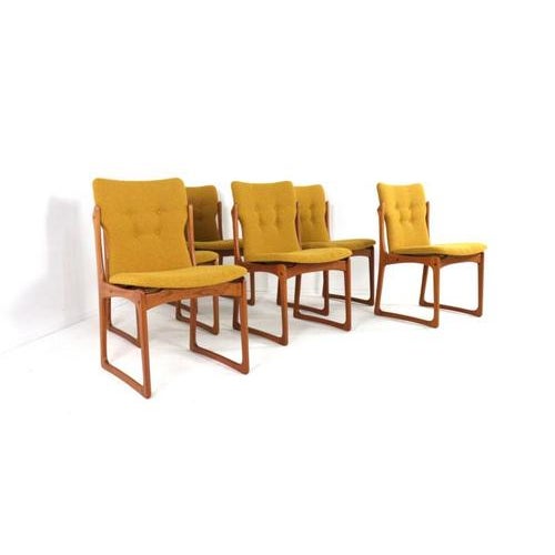 This set of six Danish dining chairs exudes the timeless elegance of Mid-Century Modern design. Crafted from warm teak,...
