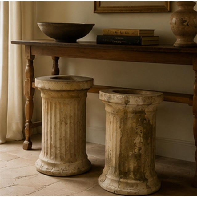 A decorative pair of antique terracotta pedestal columns dating to the 1950s–1960s. Designed as architectural supports for...