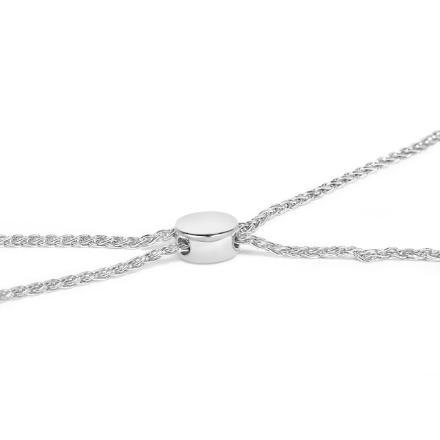 Crafted from the refined splendor of .925 sterling silver and bathed in a layer of protective rhodium plating, this...