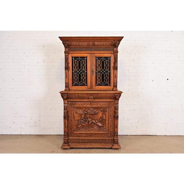 Antique French Renaissance Revival Carved Oak Breakfront Bookcase or Bar Cabinet With Stained Leaded Glass Doors, Circa 1890s For Sale - Image 14 of 14