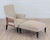 Elegant 19th century French Napoleon III armchair accompanied by its matching footstool, presenting a sophisticated...