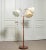 A 1950s floor lamp manufactured by Orsjö, Sweden, model 236. This elegant Scandinavian piece features a turned beechwood...