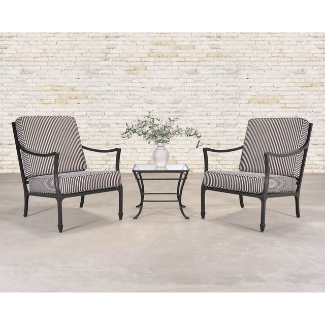 A handsome and elegant pair of McKinnon and Harris Beaufort Club Chairs (model 804A) in the Sorghum Black finish. The...