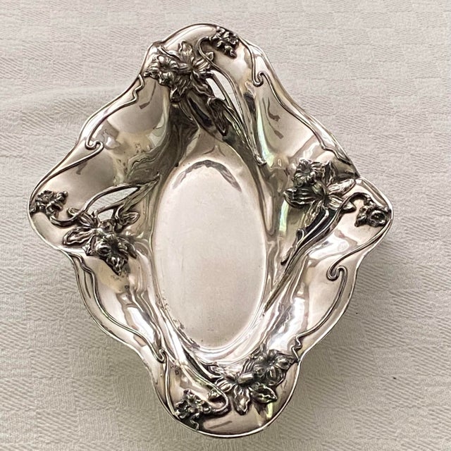 Antique Art Nouveau silver-plated centerpiece bowl manufactured by the Wilcox Silver Plate Co.. It features the...