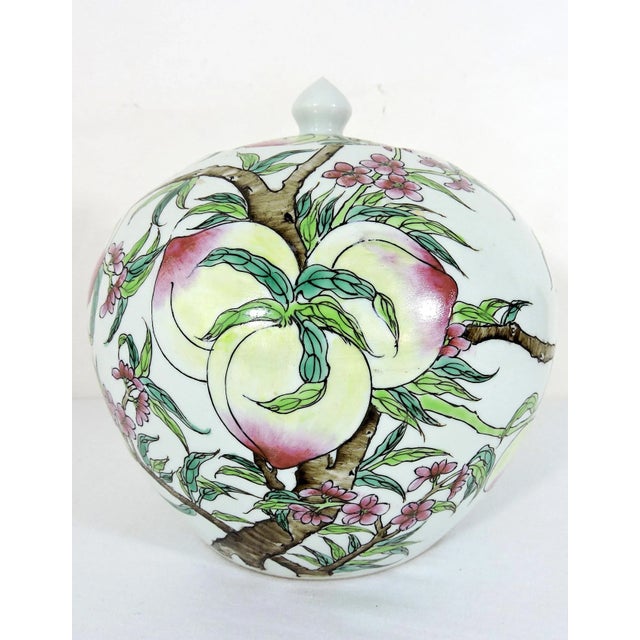 A beautiful early 20th. Century Chinoiserie oviform ginger jar hand decorated with rich under glaze enamels. The round...