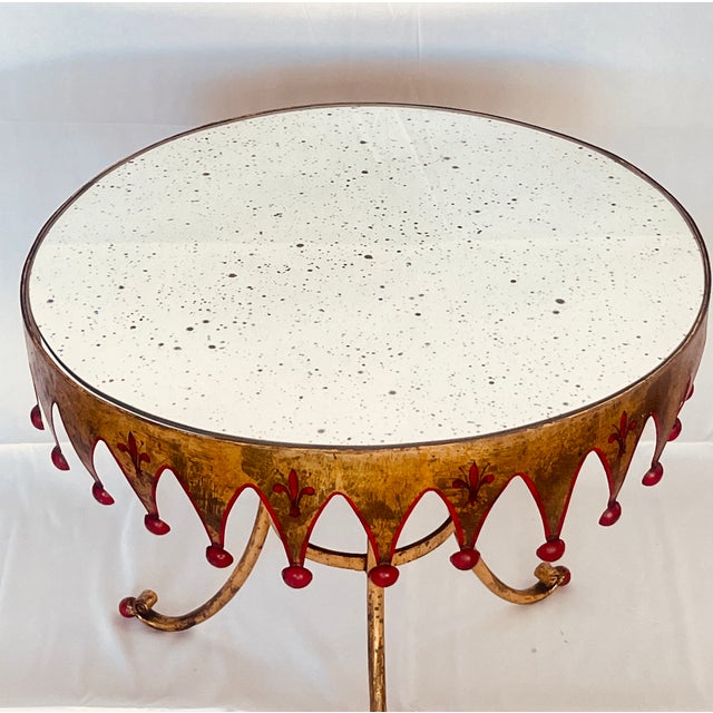 This charming Italian Gilt Metal Round Harlequin Side table with antique Mirrored Top just arrived! The charm is in the...