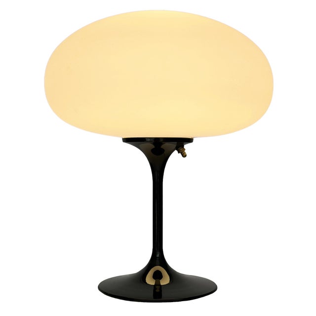 ENJOY FREE CONTINENTAL USA SHIPPING! A sleek stemlite table lamp made by Design Line. It features a cast aluminum main...