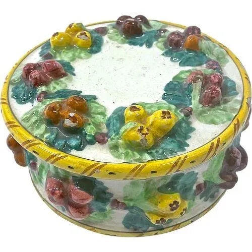 Antique fruit motif lidded ceramic jar. Marked: with a cuneiform style logo on the underside.