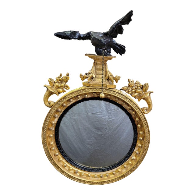 A Carved and Gilded English Regency Convex Mirror For Sale