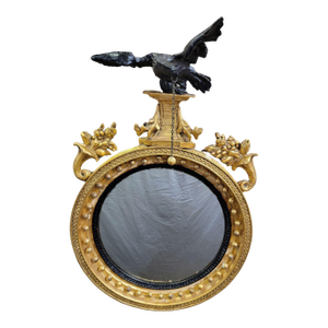 A Carved and Gilded English Regency Convex Mirror