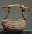 Surrealist Buttocks Basket with Driftwood and Yarn Handle Date: Mid to late 20th century Materials: Natural reed,...