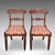 This is a pair of hall chairs. An English, fine mahogany morning room or reception seat, dating to the William IV period,...