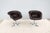 Striking pair of vintage mid-century modern split-seat swivel bucket chairs upholstered in fabulous distressed dark brown...