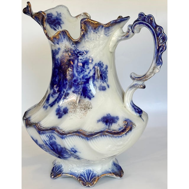 In classic blue and white flow blue with gold accents, Val's Dollhouse is proud to present this antique piece of fine...