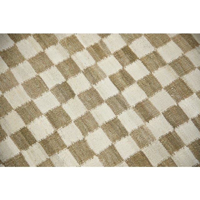 This exquisite Turkish flatweave kilim rug is a stunning masterpiece of traditional craftsmanship. Each rug is...