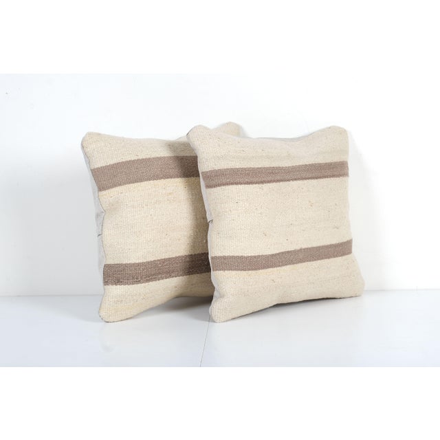 Striped Kilim Pillow Cover - A Pair Elevate your home decor with these exquisite 16" x 16" pillow covers crafted from...