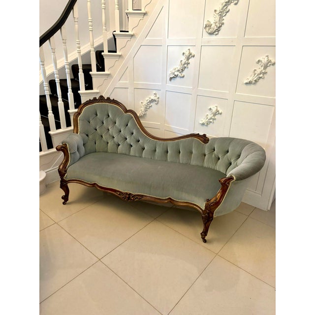 Outstanding quality antique Victorian carved walnut chaise lounge having a quality carved walnut scroll shaped back...