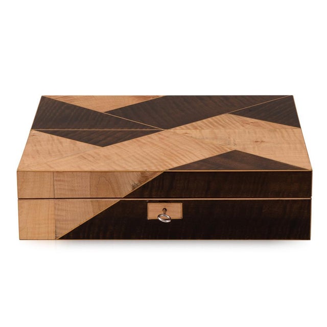 A contemporary 21st Century cigar humidor crafted from solid walnut, veneered in white rippled sycamore and smoked rippled...