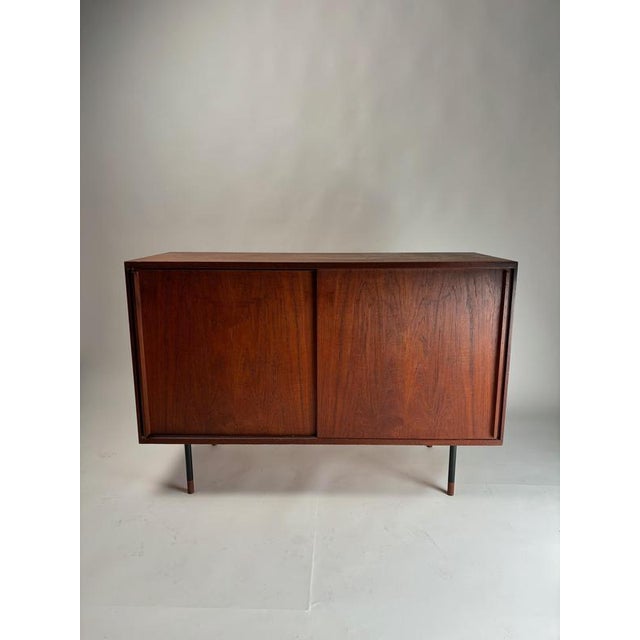 This mid-century sideboard is an elegant example of 1960s Scandinavian design. Crafted from fine teak wood, it features a...