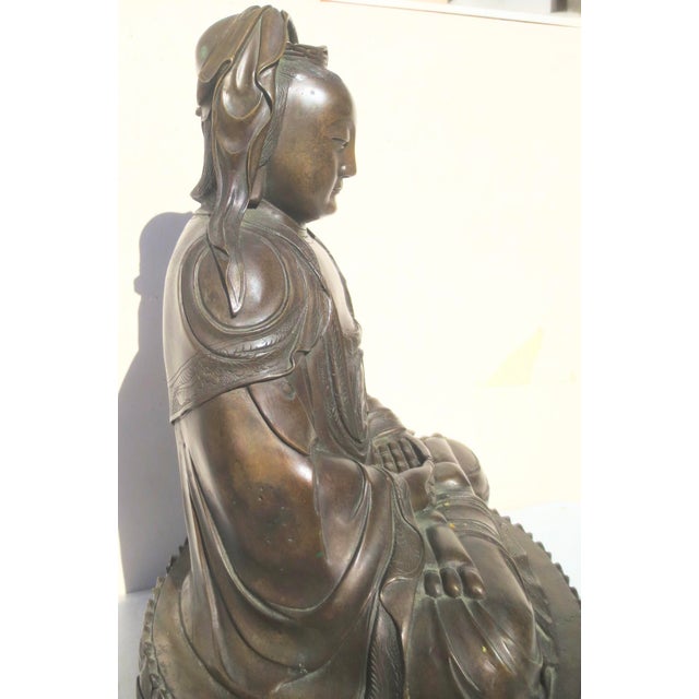 Ming style studio work of the Kuan Yin Buddha. Buddhist Fine Art sculpture. Beautifully carved and finely cast bronze with...
