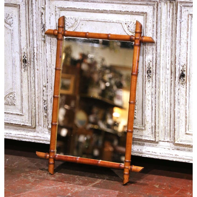 Decorate a powder room, entryway, or bedroom with this elegant antique faux bamboo mirror. Crafted in France circa 1920,...