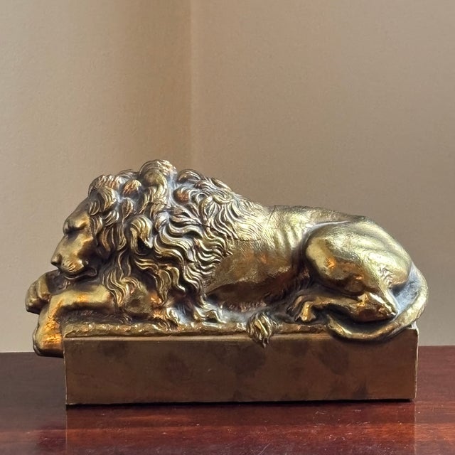Offering a gorgeous cast brass (or possibly bronze) lion figure in repose after the works of 19th century Italian sculptor...