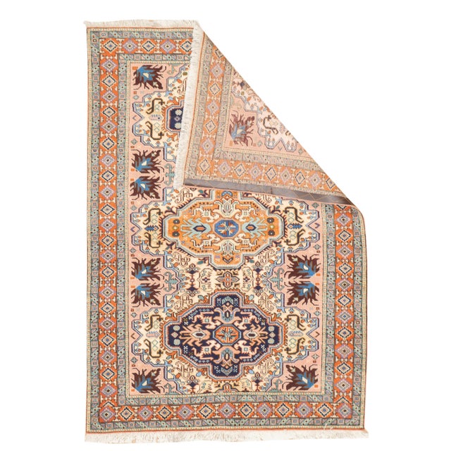 Fine vintage hand-knotted Persian Ardebil rug with a symmetrical geometric medallion design set within an ivory field....