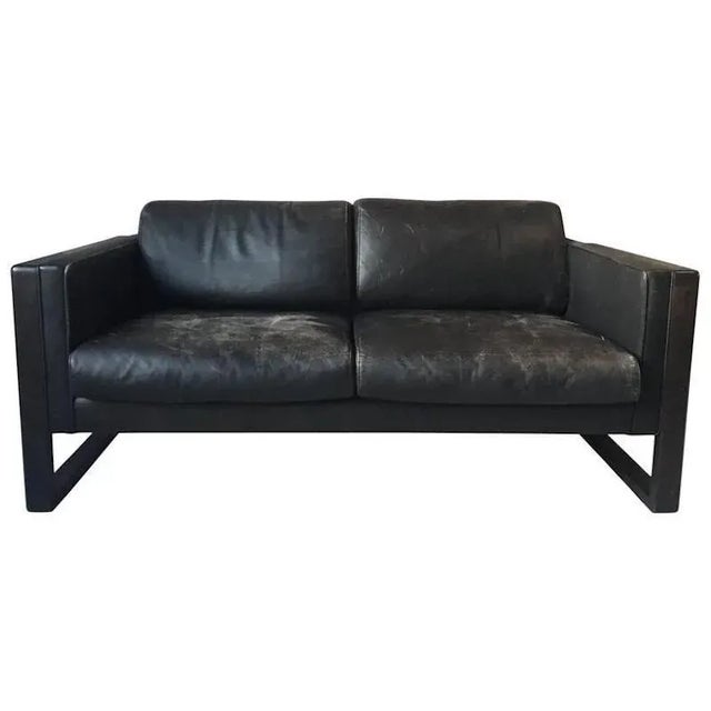 This wonderful set consists of a two seat sofa, an armchair and a coffee table and was manufactured in germany during the...