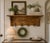 A charming golden honey tiger oak French Wall Shelf Coat and Hat Rack with four cherub hooks. Circa 1960s-1970s. This...
