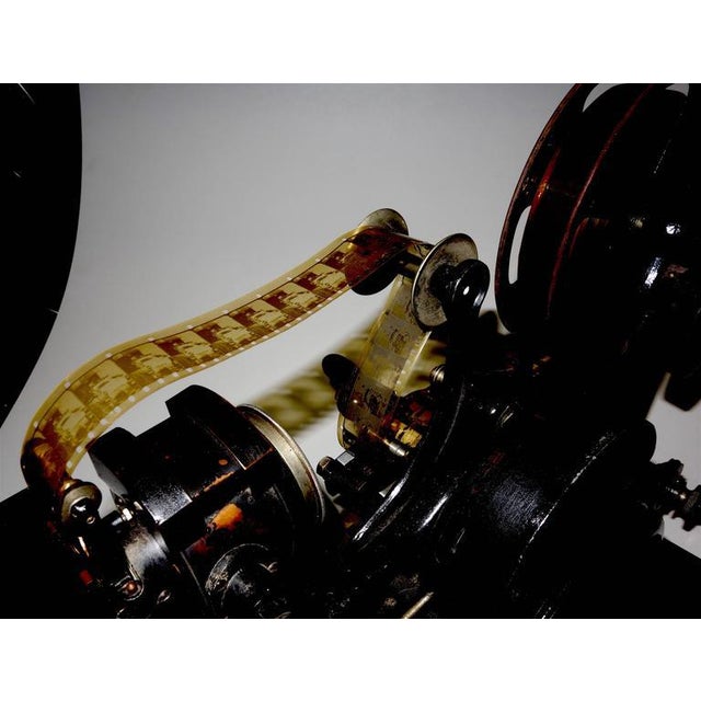 Offered for your approval, this rare example of a Pathe Freres Cinematograph Hand Driven 28mm Motion Picture Projector...