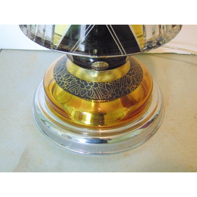 High Quality Art Deco Lamp. Clear glass with gold and black accents, acid etched floral design, chrome base, shaft and...