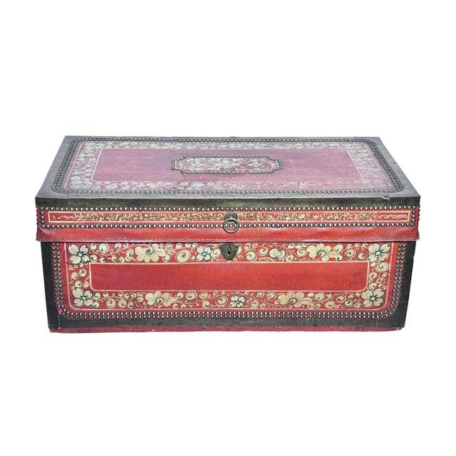 Chinese Export period red leather and camphor wood trunk, brass bound with a hand painted floral decoration border, In...