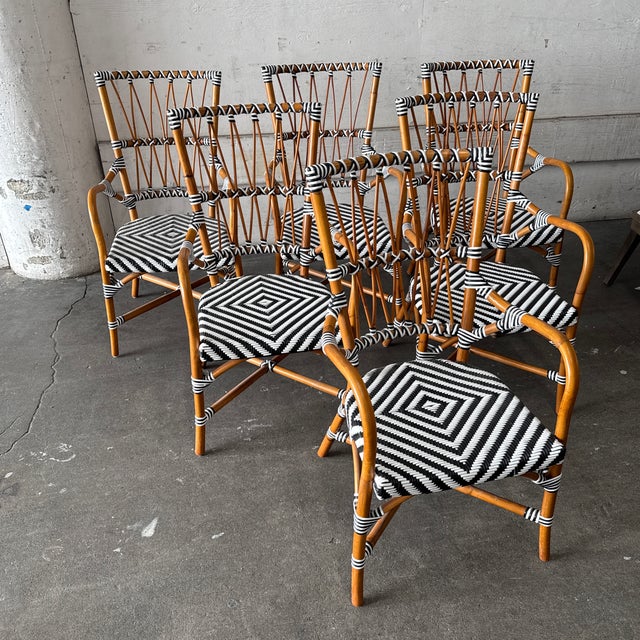 Design Plus Gallery presents a Set of Six Black & White Woven Rattan Bistro Dining Armchairs from CB2. This coordinated...