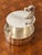A wonderfully sculptural vintage silver-plated box by Hermès Paris, distinguished by an elegant horse-head handle rising...