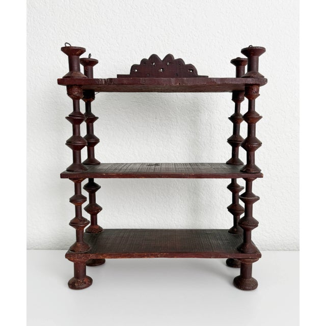Antique tramp art wood shelves made of stacked sewing spools strung together with steel wire, accented with a scalloped...